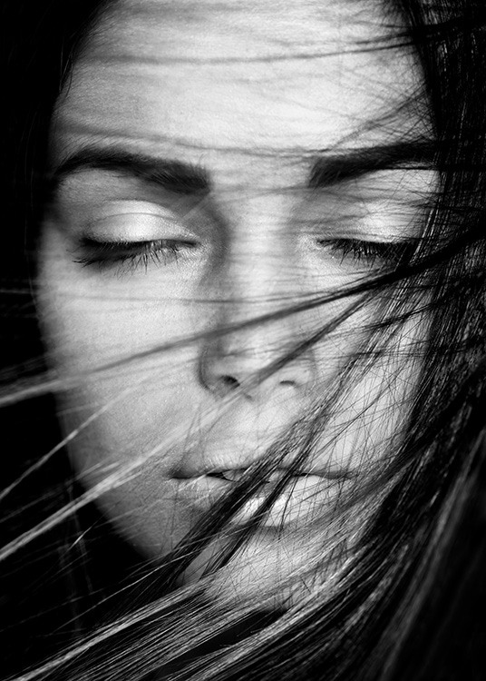 – Black & white poster of a woman with closed eyes 