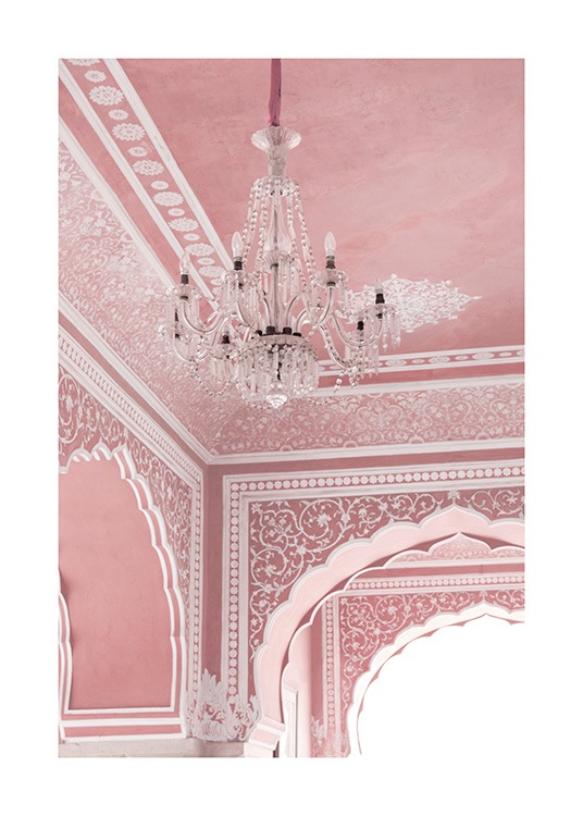 Pink room with chandelier, arches and white details