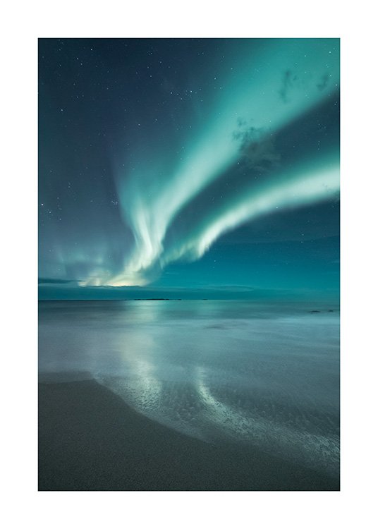  - Photograph of blue northern lights and dark blue sky in front of a sand beach