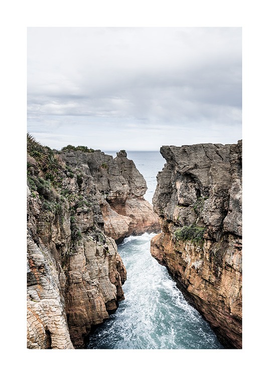  – Photograph of Dolomite Point in New Zealand with large cliffs and the ocean