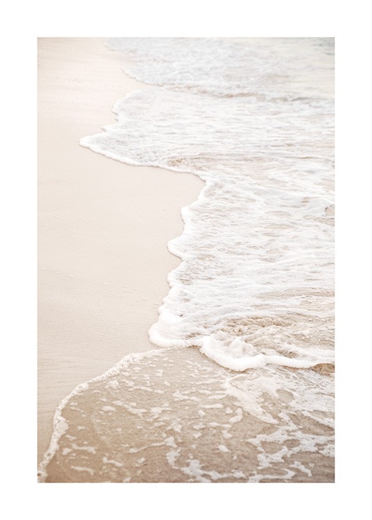 – Photograph of a beach with still waves coming onto the sand