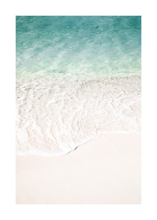  – Photograph of clear blue water and a beach with white sand