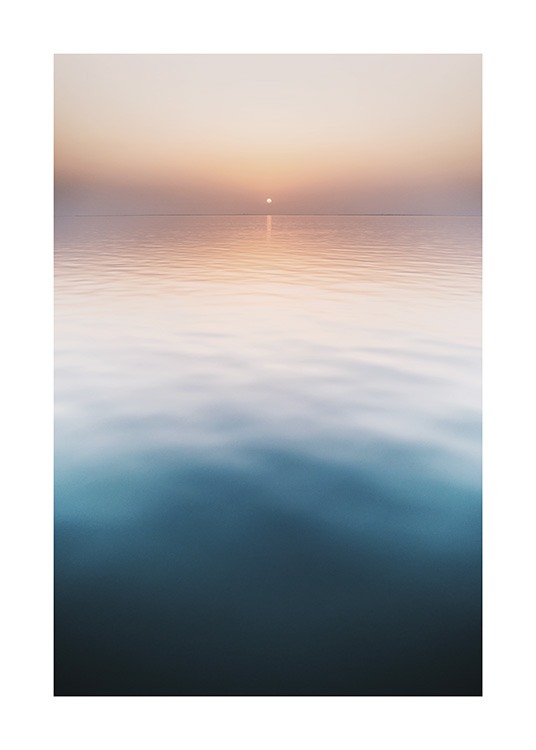  – Photograph of a sunset with a still ocean in the foreground and a pastel pink sky