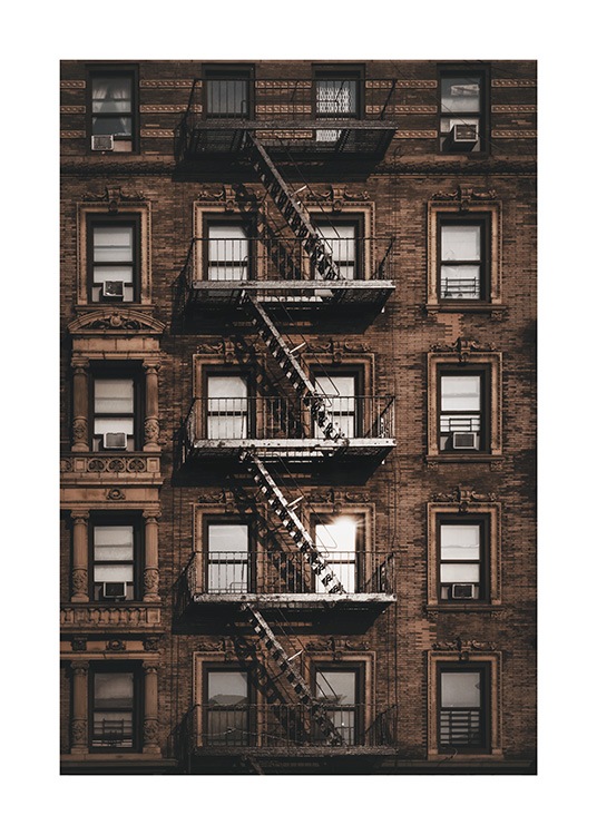 – Photograph of a building in New York with windows and a fire escape