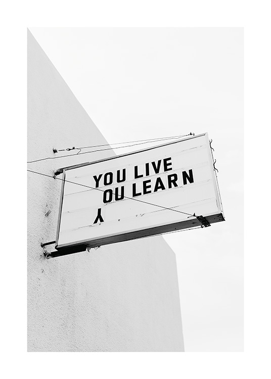  – Black and white photograph of a sign with the text \