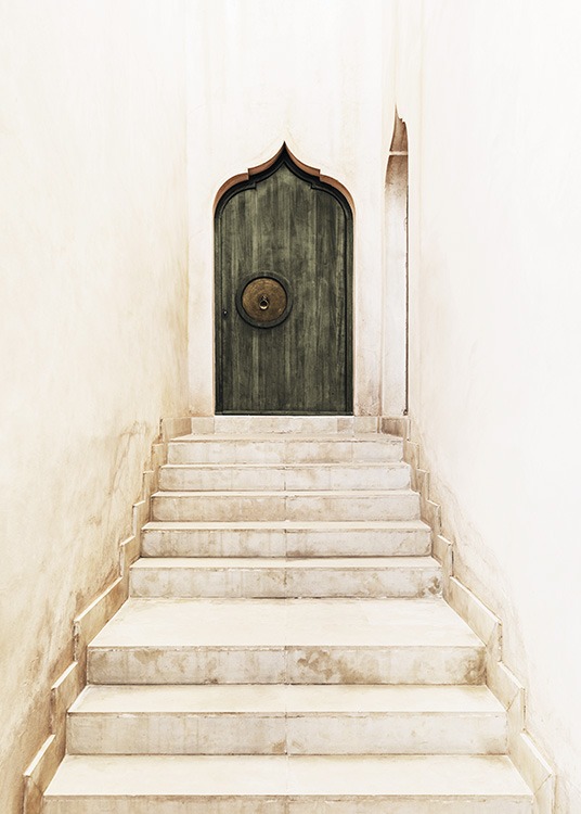  – Photograph of an arched, green door at the end of a beige marble staircase