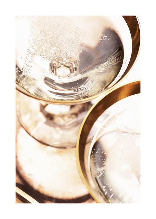  – Photograph with close up of gold rimmed champagne glasses with sparkling champagne