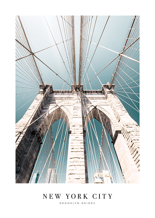  – Photograph of Brooklyn Bridge seen from below, against a blue sky and text at the bottom