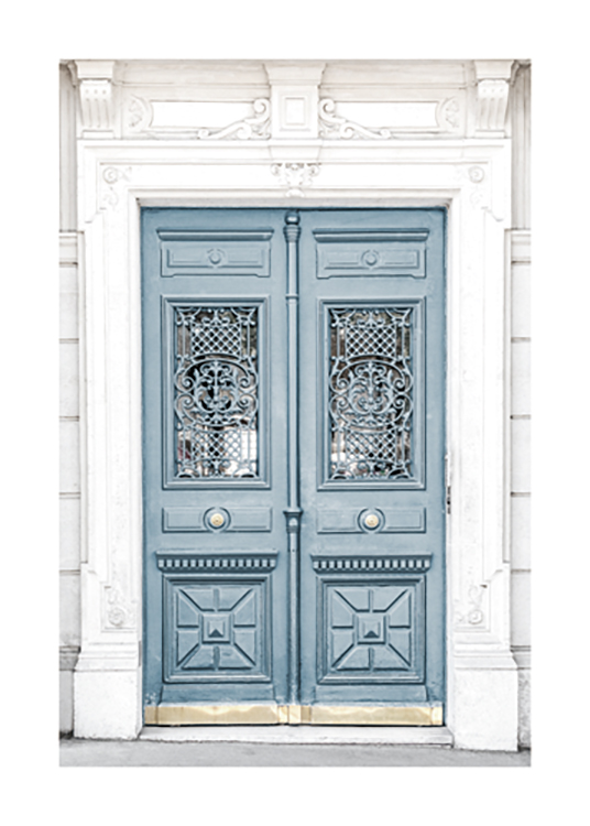  – Photograph of a blue door in a white building, with carvings in the door and the building