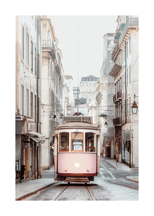  – Photograph of a tram in a vintage style, with buildings on the sides of the street