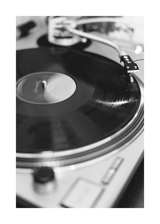  – Black and white photograph of a vinyl player with a vinyl record