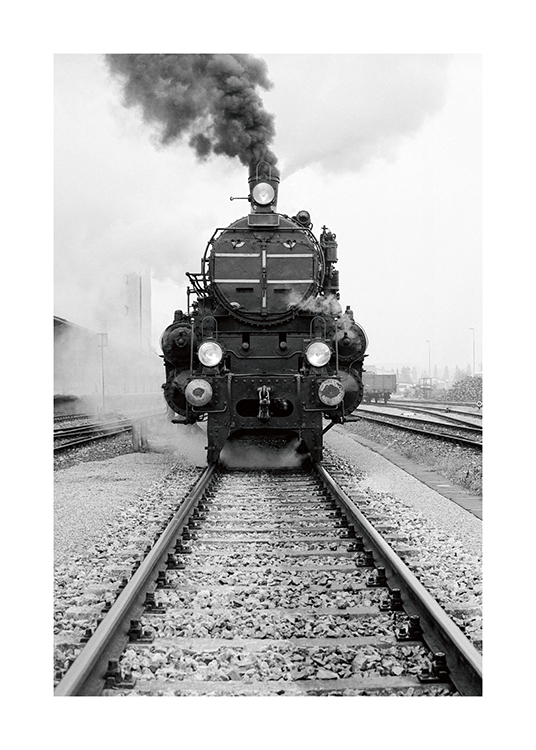  – Black and white photograph of an old train seen from the front