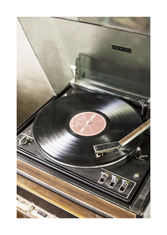  – Photograph of a vintage record player with a vinyl disc