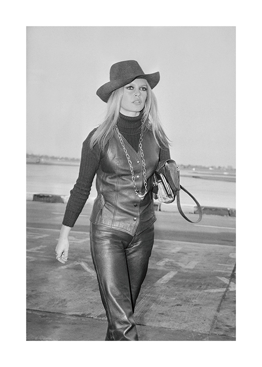  – Black and white photograph of the actress Brigitte Bardot wearing a leather outfit and hat