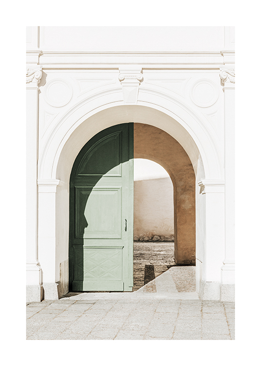  – Photograph of a green, arched door in a white building with stucco work
