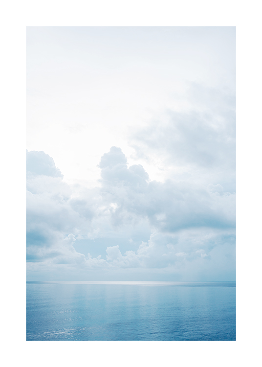  – Photograph of a blue ocean with still water and clouds in the sky above