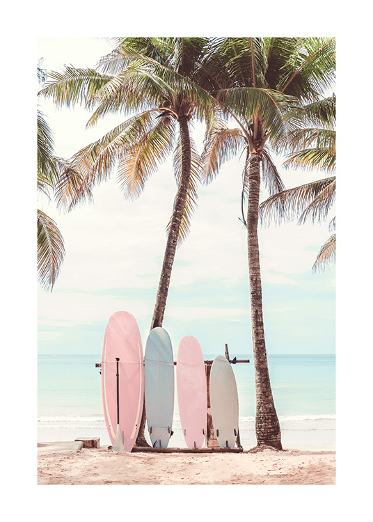  – Photograph of a couple of colorful surfboards leaning against two palm trees