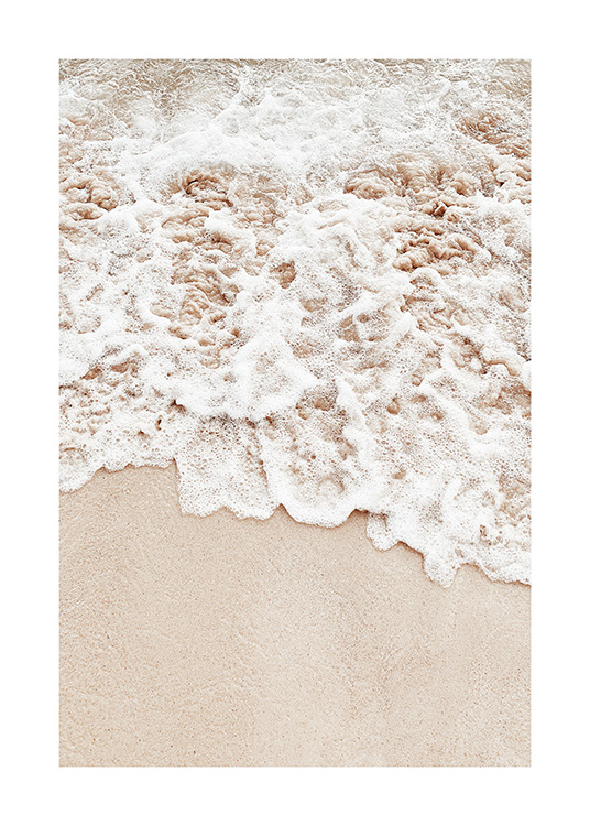  – Photograph of sea foam coming onto beige sand