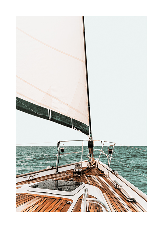  – Photograph of the front part of a sail boat and the ocean in the background