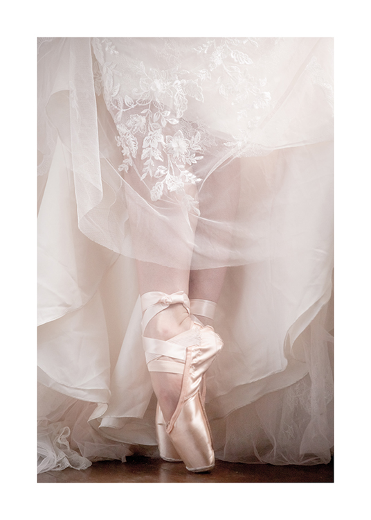  – Photograph of a pair of ballerina shoes and a lace and tulle dress around them