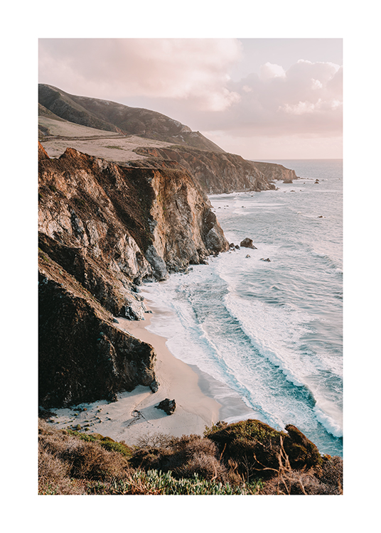  – Photograph of large cliffs forming the coastline next to the ocean