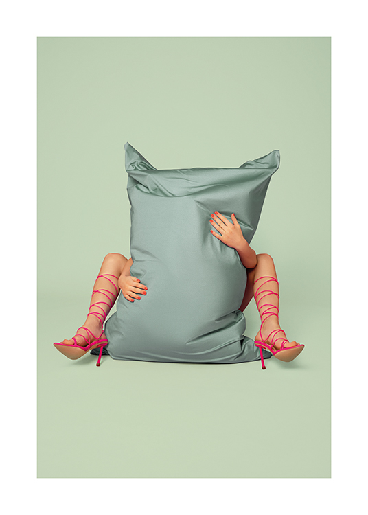  – An image of a woman in high heels sitting behind a pillow