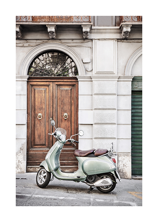  – Photograph of a retro scooter with a grey building behind it