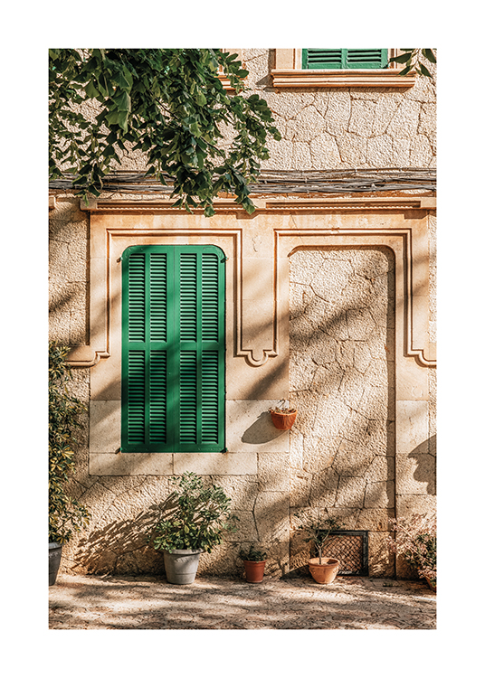  – An image of a Spanish building with a green window