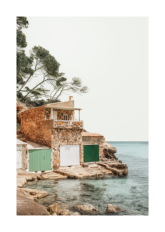  – An image of a boat house next to the sea in the Balaeric Islands, Spain