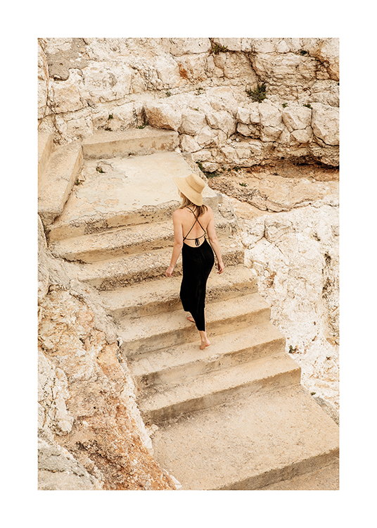  – An image of a woman walking up steps to the cliffs