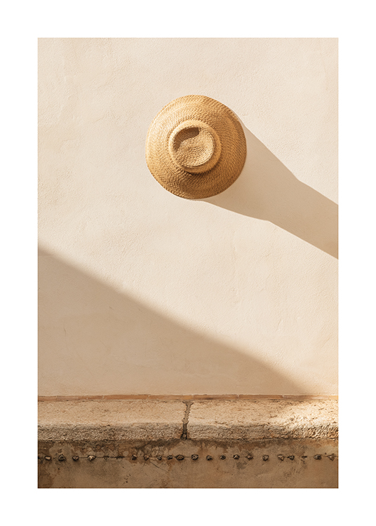  – An image of a hat on a wall projecting a shadow