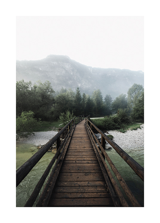  – Photograph of a landscape with water and grass underneath a wooden bridge
