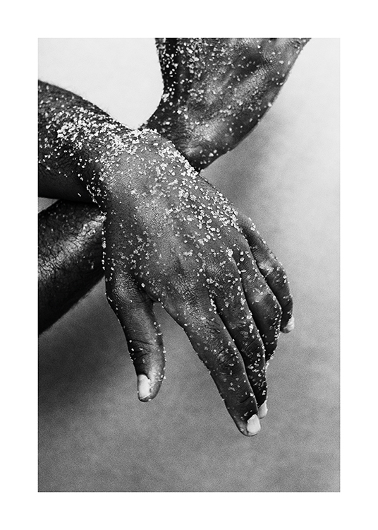  – Black and white photograph of a pair of sandy hands