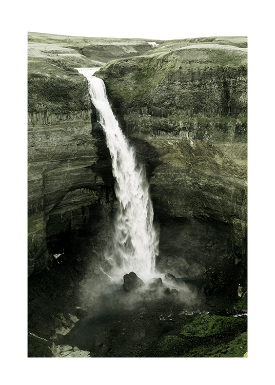  – Photograph of a green cliff landscape with a waterfall in the middle