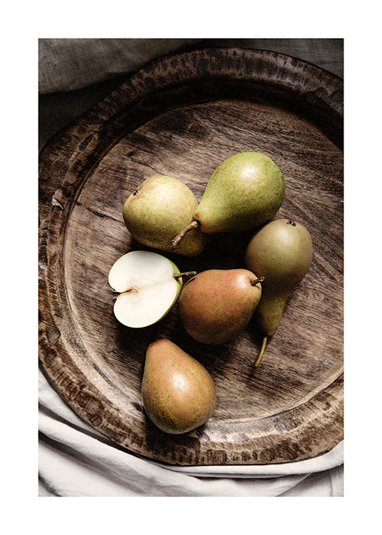 – A bunch of green pears in a beautiful rare brown bowl