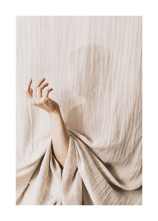 – Photograph of a hand in beige colours