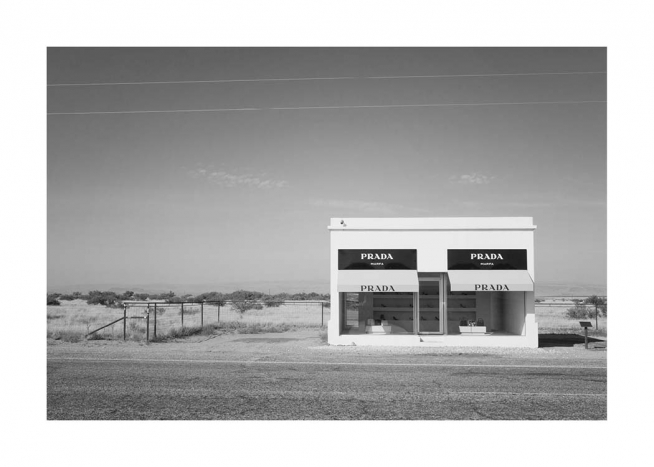  - Black and white photograph of the fake Prada Marfa Shop that's located along a road in the desert in Texas