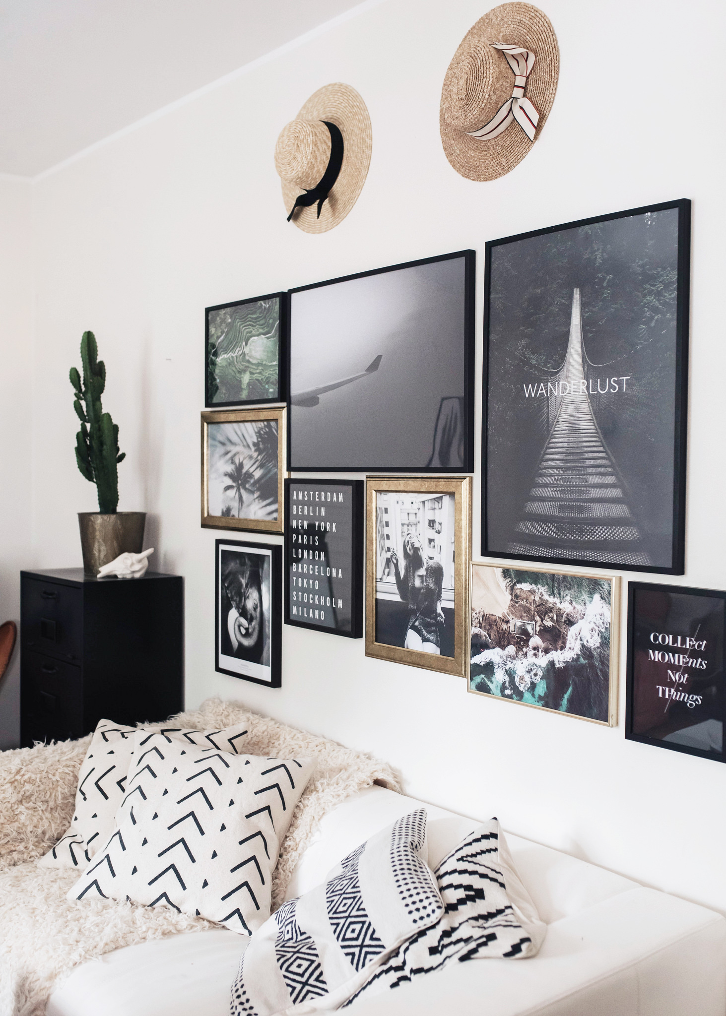 A darker gallery wall such as this is the perfect choice for white walls.